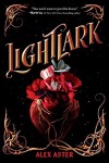 Black background with gold script title and underneath that the shape of a human heart with red flowers and one grey flower on top, gold veins wrap down the heart and move up the left and right corners of the cover